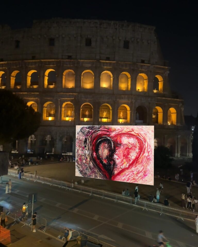 A red heart painting by Archana Aneja floating in augmented reality in front of the lit-up Colosseum at night